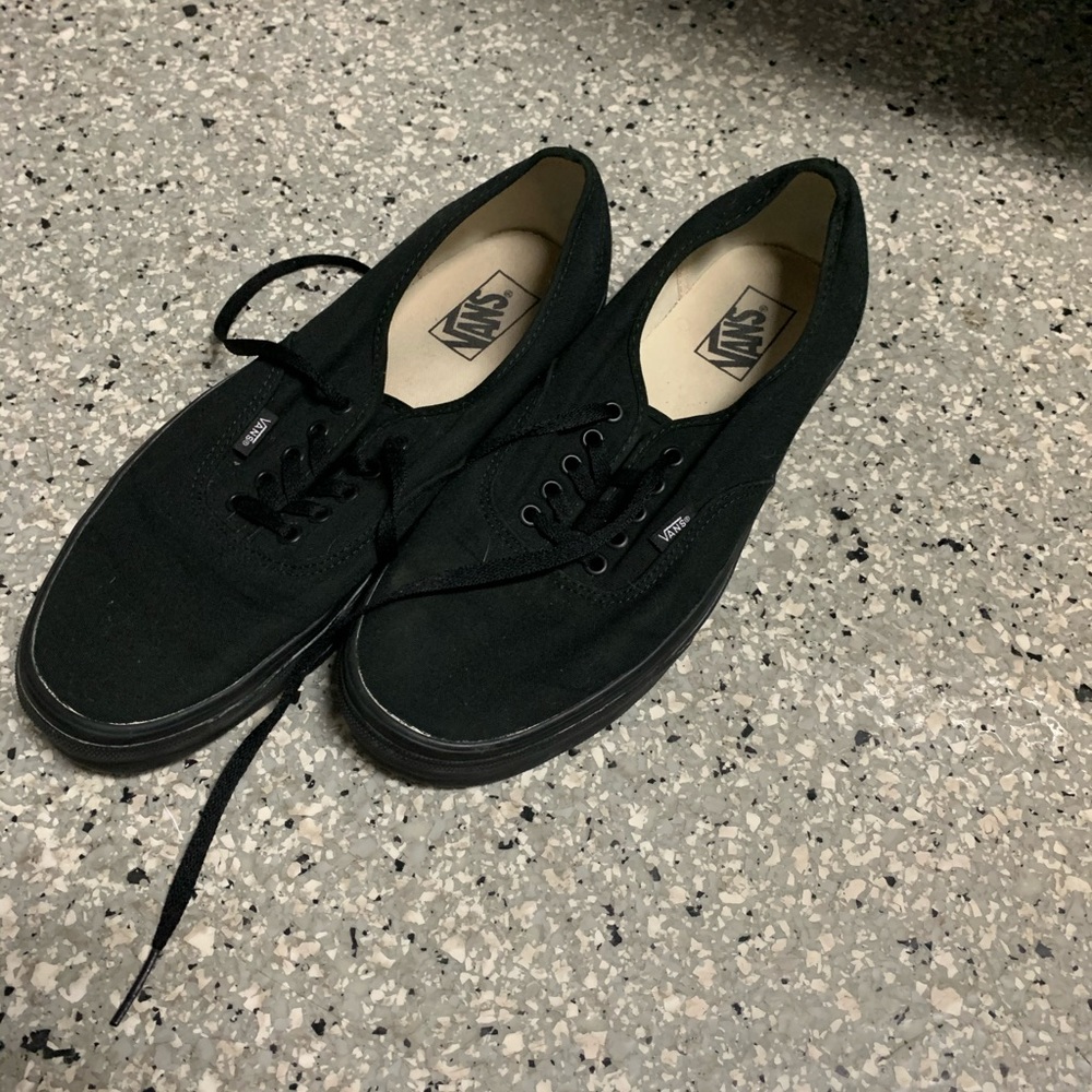 All black low top vans